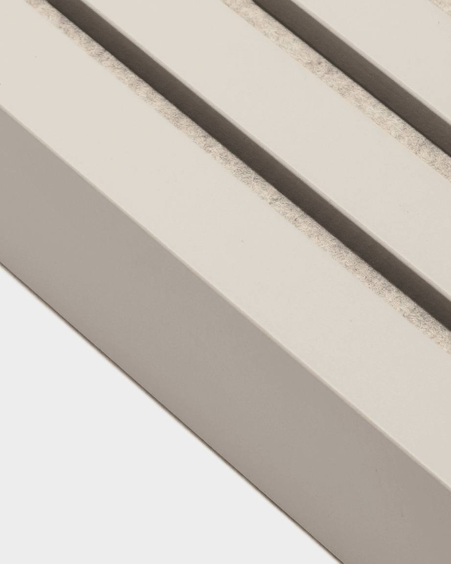 Close-up of WoodUpp End Lamella in Soft Linen (240x6.7 cm), a Nordic acoustic panel with three parallel grooves filled with sand, viewed at an angle.